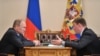 RUSSIA -- Russian President Vladimir Putin (L) and Pskov region governor Andrei Turchak meet for talks at Novo-Ogaryovo residence, December 16, 2013