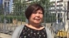 Kazakhstan - Tamara Yeslyamova, the publisher of newspaper "Uralskaya Nedelya", near the building of police department. Uralsk, 22Jun2018