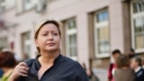 Russia -- Olga Romanova, the director of Rus Sidyashchaya (Russia Behind Bars), stands outside a Moscow court, August 18, 2014